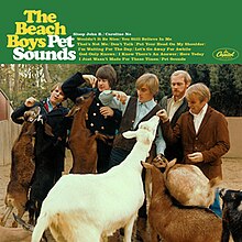 The Beach Boys at the zoo feeding apples to goats. The header displays The Beach Boys Pet Sounds followed by the album's track list.